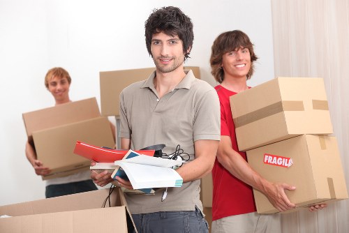 Professional movers loading items into a truck